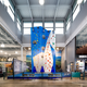 A wall for indoor rock climbing rises up in the center of a Dick's Sporting Goods store